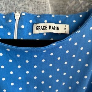 Gorgeous cornflower blue and white polkadot fit and flare dress. Fits 14-16.